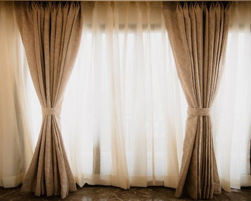 Soft natural light filtering through sheer curtains in a living room