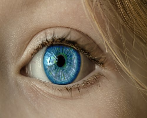 Person looking away from a computer monitor to rest their eyes